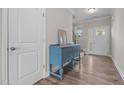 Inviting foyer featuring wood floors, an elegant staircase, and a stylish blue accent table at 2177 Campbell, Burlington, NC 27215