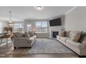 Open concept living room with wood floors, a fireplace, and neutral decor perfect for entertaining at 2177 Campbell, Burlington, NC 27215