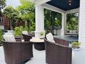 Cozy outdoor seating area on the porch, perfect for relaxing and entertaining at 275 Gholson Ave, Henderson, NC 27536