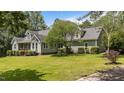 Beautiful home featuring manicured landscaping, a well-maintained lawn, and mature trees at 3113 Golden Nugget Dr, Clayton, NC 27520