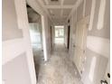 Spacious hallway with multiple doorways and a view to rooms with natural light, ready for customization at 360 Ambassador Dr, Clayton, NC 27520