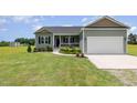 Charming single-Gathering home with attached garage and well-manicured lawn at 3724 Stevens Chapel Rd, Smithfield, NC 27577