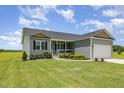 Charming single-Gathering home with attached garage and well-manicured lawn at 3724 Stevens Chapel Rd, Smithfield, NC 27577