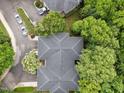 Aerial view showcasing the home's roof, mature trees, and surrounding neighborhood at 4511 Crab Creek Dr # 101, Raleigh, NC 27612