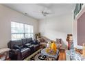 Comfortable living room with a large window, plush seating, and stylish decor, perfect for relaxation at 6001 Winged Willet Ct, Wendell, NC 27591