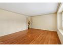 Bright living room with hardwood floors, neutral walls, and trim at 7620 Harps Mill Rd, Raleigh, NC 27615