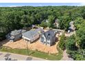 An aerial view of the new construction home, situated in a lush, green neighborhood at 1229 Dixie Trl, Raleigh, NC 27607