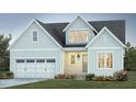 Charming home boasts a light blue exterior, well-manicured lawn, and a two-car garage for modern living at 152 Big Bradley Dr, Wendell, NC 27591
