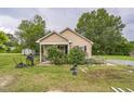 Cozy home featuring well-maintained landscaping, lawn equipment, and inviting charm at 1726 Morgantown Rd, Burlington, NC 27217