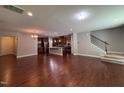 Open floor plan showcasing hardwood floors, modern kitchen, and a staircase at 238 Alamosa Pl, Cary, NC 27519