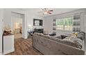 Comfortable living room with a large TV, plush sectional, and view into the bedroom at 2730 Spring Valley Dr, Creedmoor, NC 27522