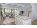Bright living room featuring neutral tones, large windows, plush seating, and open floor plan concept at 290 Grand Silo Rd, Raleigh, NC 27603