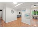 Bright condo entryway leads to a spacious living room and dining area with wood-look floors at 3086 Colony Rd # C, Durham, NC 27705
