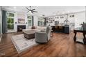 Bright living room with a fireplace and open access to the kitchen and dining area at 3400 Appling Way, Durham, NC 27703