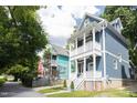 Charming two-story home with bright siding and inviting front porch at 507 Rosengarten Aly, Raleigh, NC 27603
