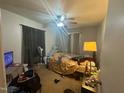 Bedroom with ceiling fan and dark curtains at 625 Revell Rd, Selma, NC 27576