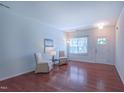 Bright living room featuring hardwood floors, a large window and ample space at 916 Woodside Park Ln, Durham, NC 27704