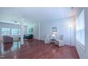 Spacious living room with gleaming hardwood floors and lots of natural light at 916 Woodside Park Ln, Durham, NC 27704