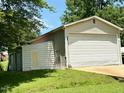 Spacious detached garage with multiple bays, offering ample storage and workspace at 94 S Waters Edge Ln, Henderson, NC 27537