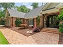 Beautiful brick home with an inviting front entrance and lush landscaping at 9940 Koupela Dr, Raleigh, NC 27614
