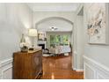Inviting foyer with hardwood floors that leads into the living room and other living spaces at 1034 Ventnor Pl, Cary, NC 27519