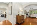 Foyer with hardwood floors and an archway leading into the living room at 1034 Ventnor Pl, Cary, NC 27519