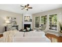 Cozy living room features a fireplace and windows that let in plenty of natural light at 1034 Ventnor Pl, Cary, NC 27519