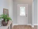 Bright foyer with new floors and decorative glass in the front door at 12320 Tetons Ct, Durham, NC 27703