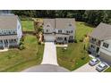 Aerial view of a well-maintained home with a spacious yard and neighborhood setting at 185 Twilight Trl, Willow Springs, NC 27592