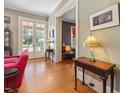 Elegant living room with hardwood floors, classic decor, and large windows for natural light at 2400 Fairview Rd, Raleigh, NC 27608