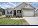 Charming single-story home with a two-car garage, landscaped yard, and covered porch at 2760 Rains Mill Rd, Princeton, NC 27569