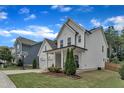 Lovely view of the home highlighting its manicured lawn and complementing neighborhood homes at 3181 Zebroid Way, New Hill, NC 27562