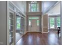 Bright foyer features hardwood floors, high ceilings, and an arched transom window at 405 Widdington Ln, Cary, NC 27519