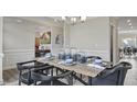Charming dining area with modern table setting and decor at 413 Falls Bluff Dr, Wake Forest, NC 27587