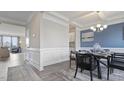 Elegant dining room featuring a coffered ceiling and stylish decor at 413 Falls Bluff Dr, Wake Forest, NC 27587