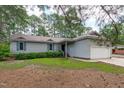 Charming single-story home with a well-maintained lawn, light grey siding, and a two-car garage at 502 Hillcrest Rd, Apex, NC 27502