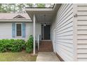 The home features a welcoming front porch with a classic entrance and neat landscaping at 502 Hillcrest Rd, Apex, NC 27502