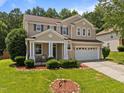 Charming two-story home with manicured lawn and a two-car garage, perfect for families at 504 Ashburn Ln, Durham, NC 27703