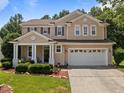 Charming two-story home with manicured lawn and a two-car garage, perfect for families at 504 Ashburn Ln, Durham, NC 27703