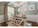 Bright office with a coffered ceiling, wainscoting, and large windows at 508 Morning Oaks Dr, Holly Springs, NC 27540