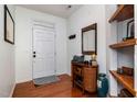 Inviting foyer with wood floors, decorated shelves, and neutral colors at 513 Dragby Ln, Raleigh, NC 27603
