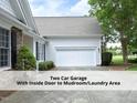 Two-car attached garage with a driveway, close to front entrance at 603 Red Cedar Cir, Durham, NC 27712