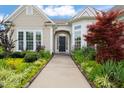 Inviting front entrance with a beautifully landscaped walkway leading to the front door at 610 Mixboro Dr, Cary, NC 27519