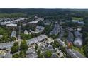 Aerial view showcasing a neighborhood with tree-lined streets and varied architectural styles at 922 Edgewater Cir, Chapel Hill, NC 27516