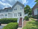 Back exterior featuring a deck with stairs and a well manicured lawn at 922 Edgewater Cir, Chapel Hill, NC 27516