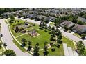Aerial view showcasing a well-planned community, manicured lawns, walking paths, and common areas at 104 Treywood Ln, Chapel Hill, NC 27516