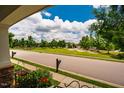 Scenic street view with lush green lawns, mature trees, and well-maintained landscaping at 104 Treywood Ln, Chapel Hill, NC 27516