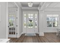 Bright foyer showcasing hardwood floors, elegant lighting, and a welcoming entrance at 1108 Lowland St, Apex, NC 27523
