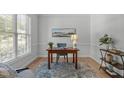 Cozy office space with hardwood floors, a large window, and classic furnishings at 117 Drakewood Pl, Cary, NC 27518