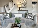 Comfortable living room with stylish furniture, decor, and stairway in view at 118 Chestnut St, Durham, NC 27707